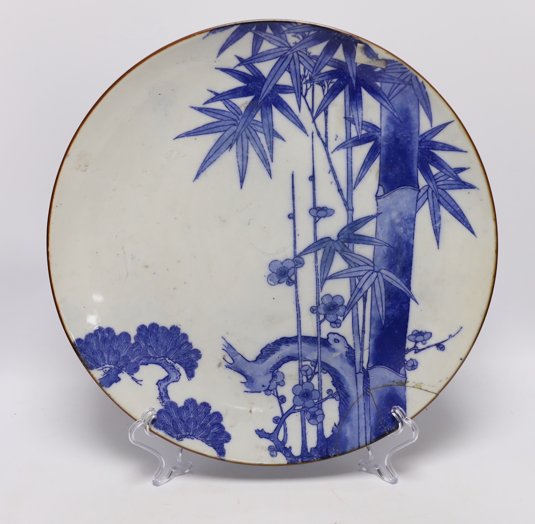 Japanese and Chinese ceramics including blue and white bamboo plate, blanc de chine figures, and Buddha with erotic scene to the base, largest 42cm high